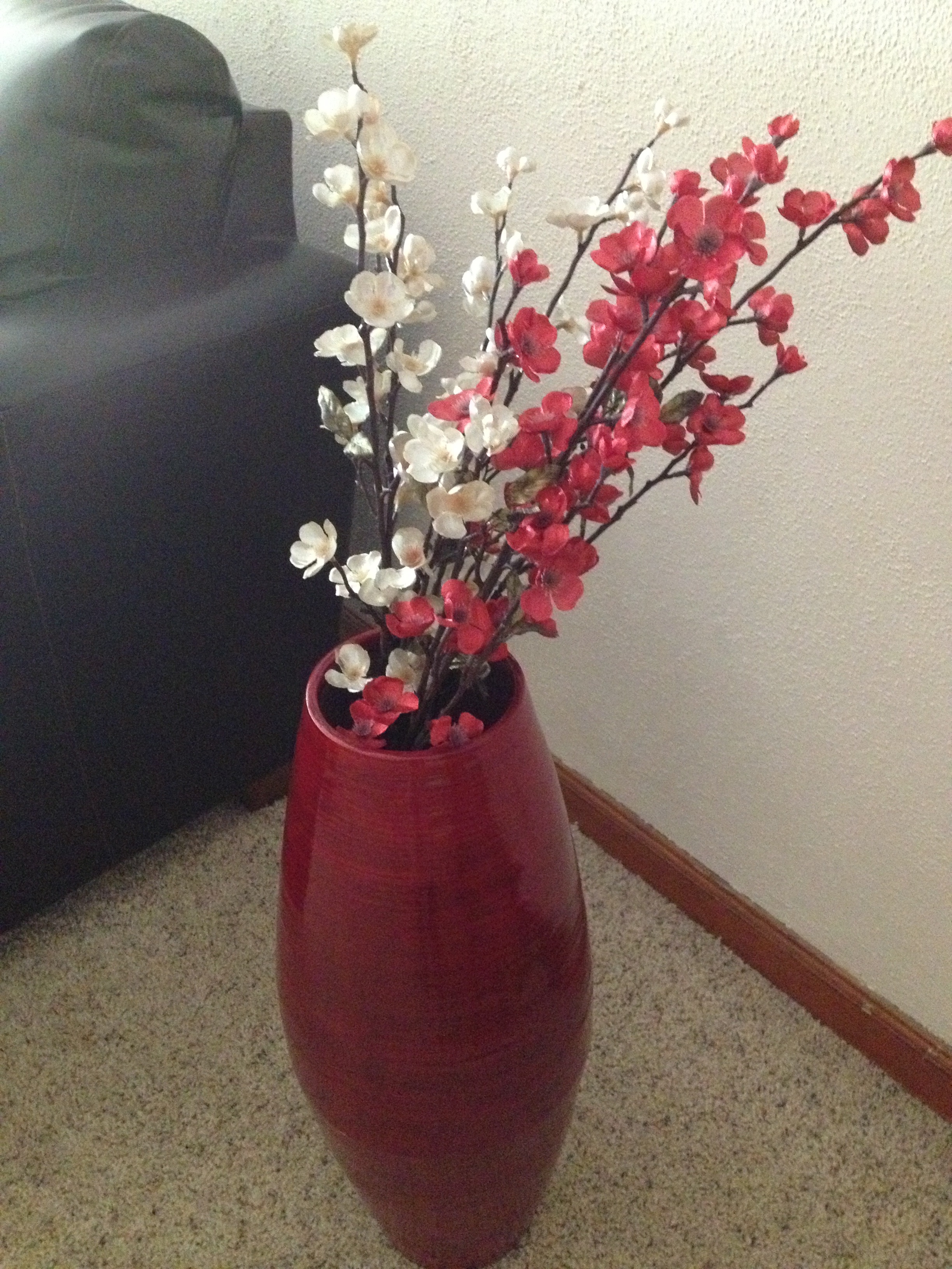 Red vase with flowers