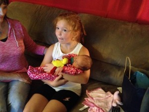 Violet holding her cousin Piper