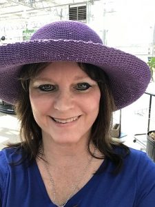 me trying on purple gardening hat, just for fun