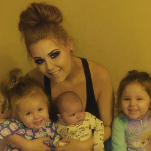Eden with 3 of her 4 kids. I love her "mom bun."