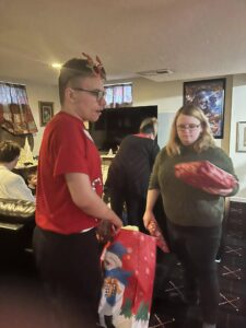 Derek's son Jayden and Leah passing out gifts. Everyone helped!!